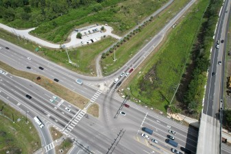 Before construction: Looking northwest over SR 54 at the Suncoast Trail and the trailhead (5-13-2026 photo)