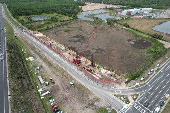Looking southwest at construction of the trail bridge approach on the south side of SR 52 (4-9-2026 photo)