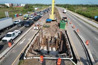 Looking west over SR 52 at bridge pier construction in the median (6-10-2026 photo)