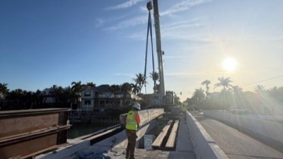 Crane places bridge deck panels (April 2026 photo)