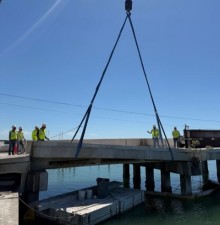 Crane places bridge deck panels (March 2026 photo)