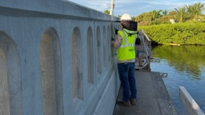 Repair and finish the bridge traffic railing (September 2026 photo)