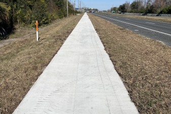 Looking north along US 41 at new sidewalk north of Land O' Lakes High School (1-28-2026 photo)
