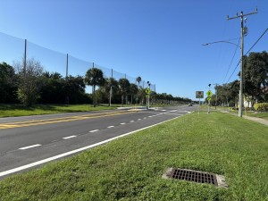 Looking southbound at ALT 19 at a new Rectangular Rapid Flashing Beacon (RRFB) mid-block crossing just north of Duchess Boulevard (September 2026 Photo)