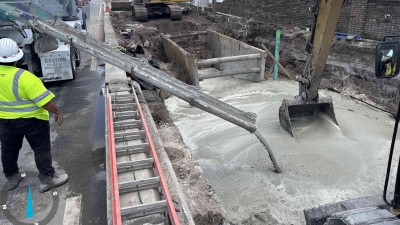 Crews pour concrete along Curlew Road (April 2026 photo)
