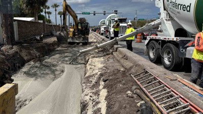 Looking west as crews pour concrete along Curlew Avenue (March 2026 photo)
