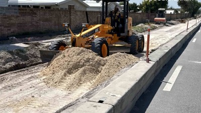 Looking west on Curlew Avenue as crews perform base work (March 2026 photo)