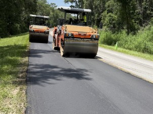 Rolling freshly placed asphalt on CR 39 / E Withlacoochee Trail (7-21-2026 photo)